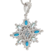 Oval blue turquoise sterling silver pendant with sparkling gemstone accents, elegant jewelry piece.